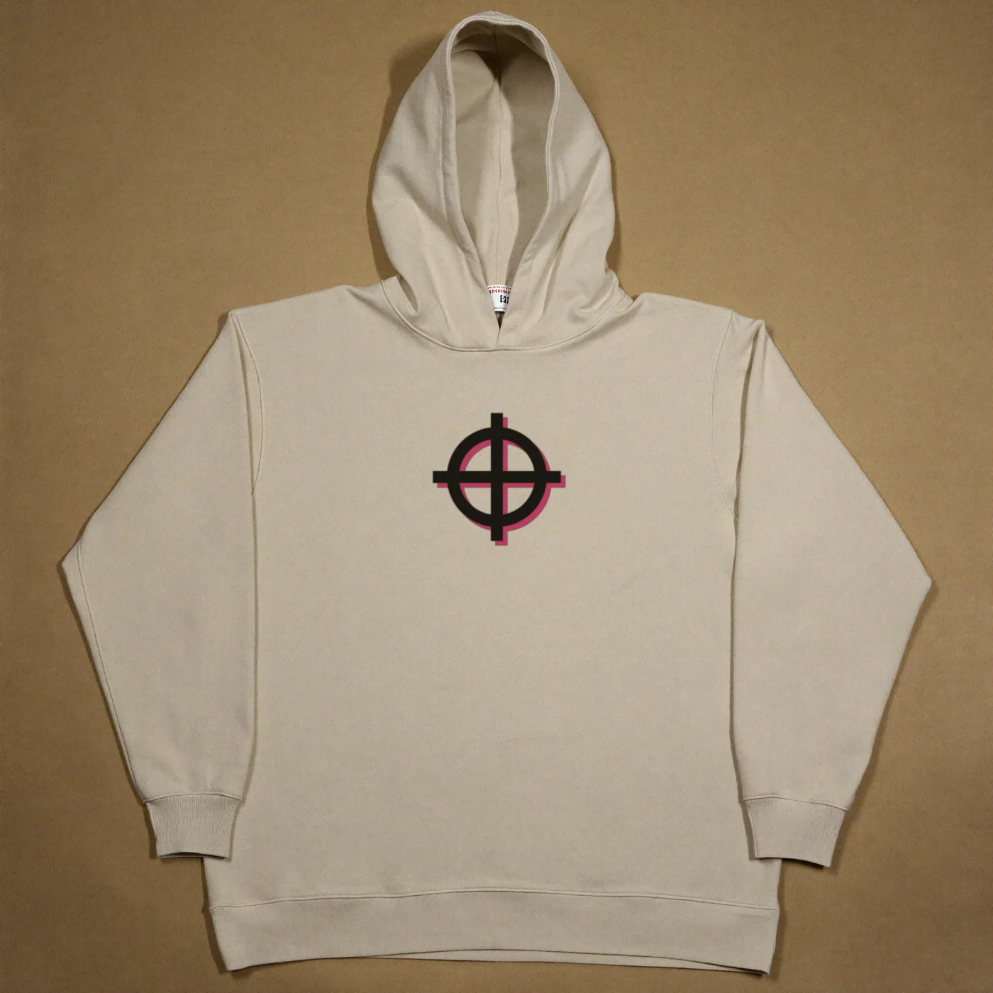 A cream heavyweight cotton hoodie laid flat, with OTRO's off-register registration target printed on the chest